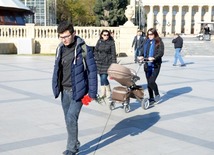 Baku residents bringing flowers to Seaside Boulevard to honor missing oil workers.  Azerbaijan, Dec.07, 2015